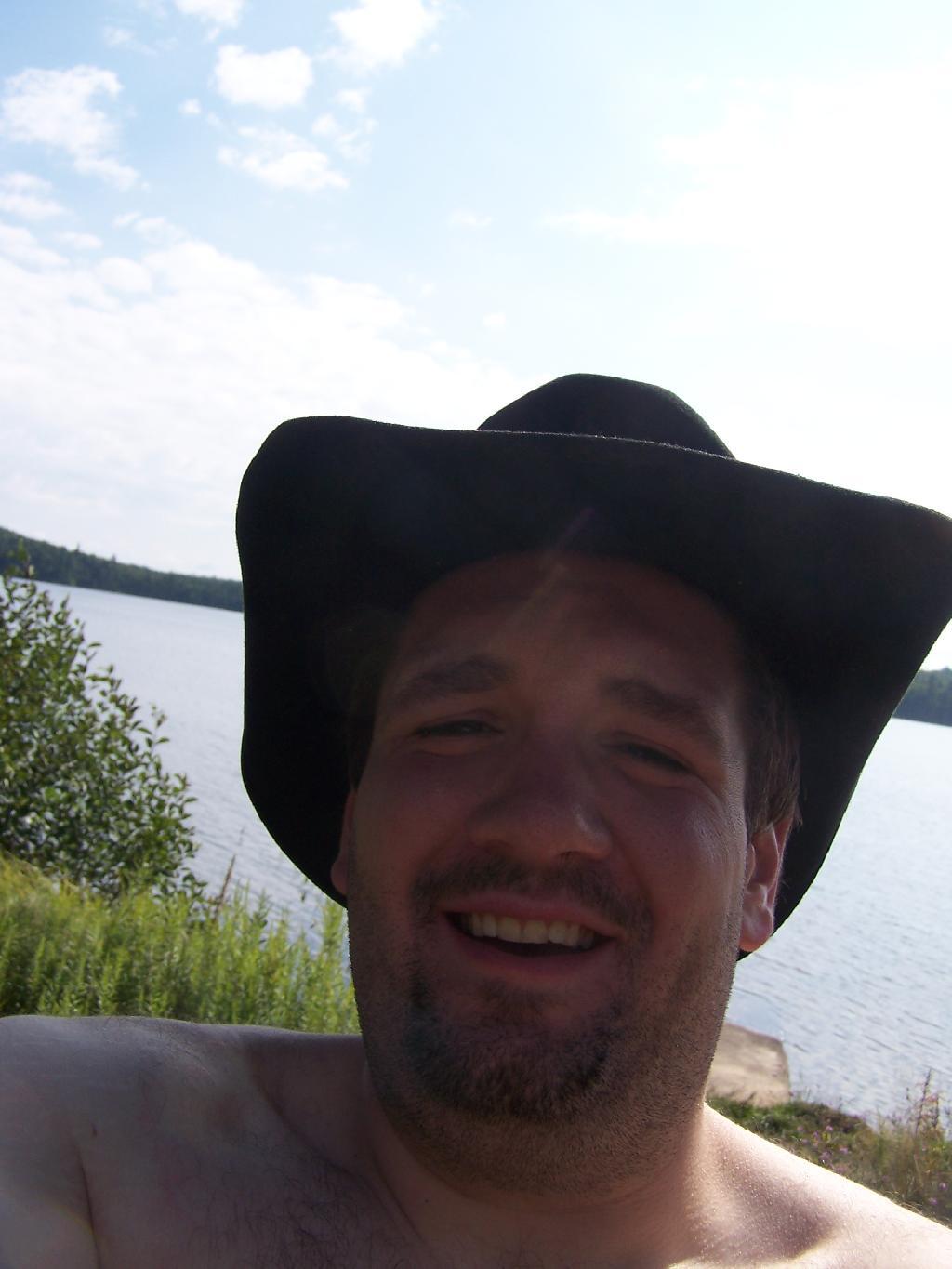 Photo: Cowboy Hat, Swimming Trunks, Work Boots. Photo: Cowboy Hat, Swimming Trunks, Work Boots.