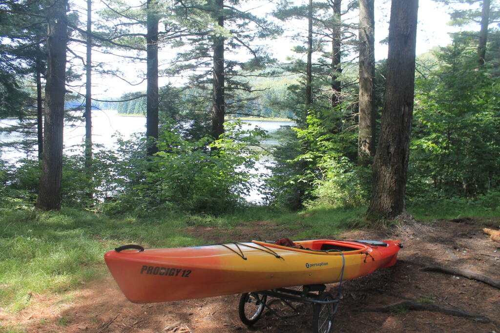 Photo: Strapping Down Kayak for Portage Back to Truck Photo: Strapping Down Kayak for Portage Back to Truck