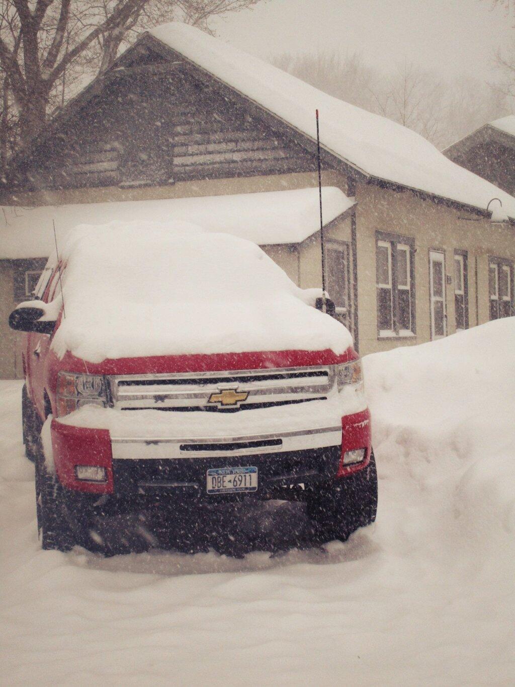 Photo: Keeping Snow Off Big Red A Futile Effort Photo: Keeping Snow Off Big Red A Futile Effort